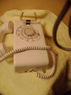 rotary dial wall phone in 1970 Now