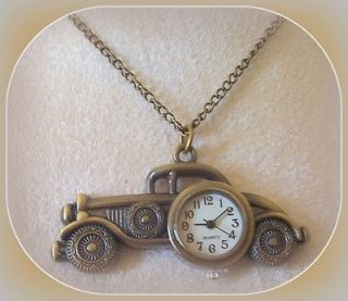   ANTIQUE GOLD TONE OLD FASHIONED CAR W/CLOCK ON 30 ANT. GOLDTONE CHAIN