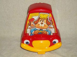VINTAGE TOMY WIND UP STROLLER TOY,1987,Wind it and the dog driver 