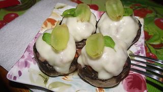 Button Mushrooms stuffed with minced meat with lemon basil and grapes 