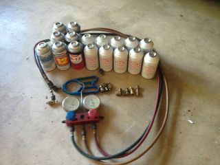 17 cans of r12 freon r 12, snap on gauge set, can tap and adapters