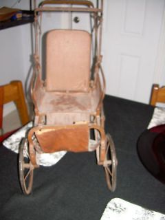 Antique doll stroller 1919 metal frame leather seat and back