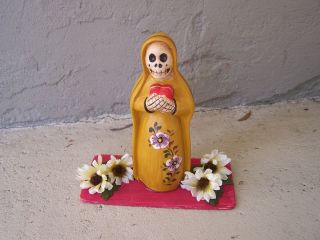 Yellow La Santisima Muerte Sculpture with Flowers   Peru