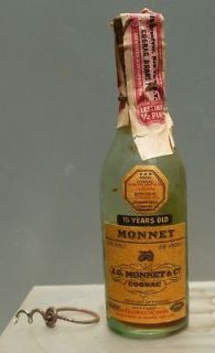   Labeled Light Green Monnet Cognac/Brandy Bottle W/Miniature Corkscrew