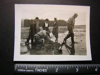Photo 01871 people dig ditch in mud w shovels, what r u looking 