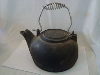 antique cast iron kettle with swivel lid 