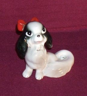 Unmarked Japanese Pretty Chin Vintage sitting porcelain dog figurine