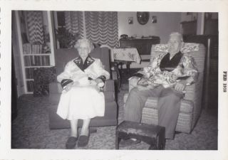   PHOTO ELDERLY MAN & WOMAN IN CHAIRS SMOKING JACKETS TELEPHONE 1958