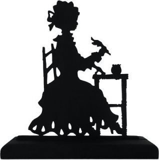 victorian lady at small writing table wood silhouette time left