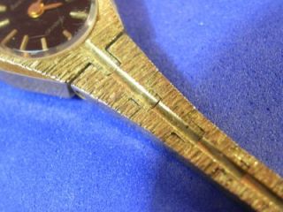 ACCURIST LADIES GOLD TONE STRAP STAINLESS STEEL BACK SMALL BLACK FACED 