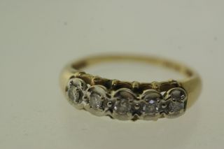 Vintage aniversary style ring in 14k yellow gold with 5 small diamonds 