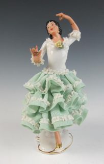   is this vintage dresden lace porcelain figurine of a spanish dancer
