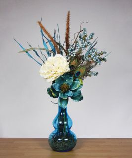   Floral Arrangement with Blue and Cream Flower in Blue Glass Vase