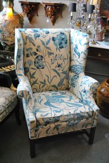 wingback chair in white and blue upholstery 
