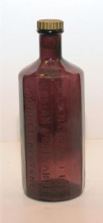 Purple Amethyst Glass 12 sided round bottle A. Lancasters Jaundice 