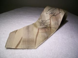 You are looking at a gently used Enrico Capucci Neck Tie autographed 