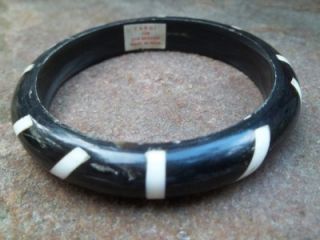 bangle bracelet of ebony and ivory coloured bone
