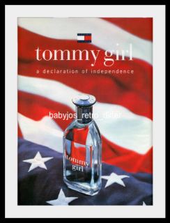   is a 1997 TOMMY HILFIGER print advertisement for TOMMY GIRL perfume