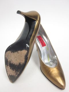 you are bidding on a pair of charles jourdan 1921 bronze pumps heels 