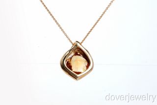  cut citrine approx 6.00cttw, bezel set. This pendant is in very good