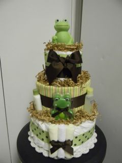 tier diaper cake loaded with lots of baby items and placed in a cake