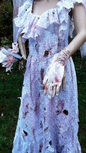  She thirsts for human flesh and her gown is covered in blood and gore