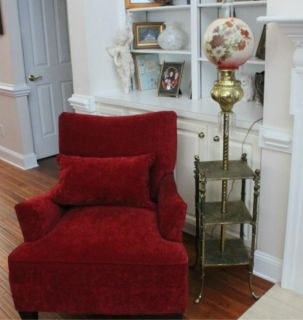  floor lamp the lamp has three ornate shelves with a antique globe and