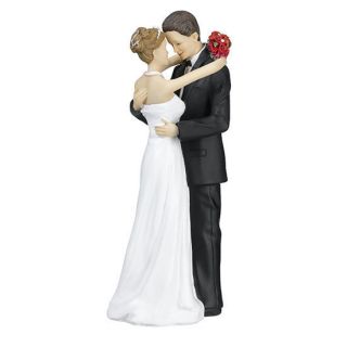 This beautiful wedding figurine depicts a bride and groom in tender