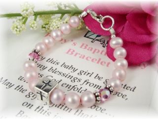 Precious baby girl baptism bracelet designed with beautiful pink