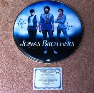 Jonas Brothers Autographed Drumhead with Certificate of Authenticity  