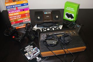 Atari 2600 Console w Pong Keyboard Controllers and 12 Games
