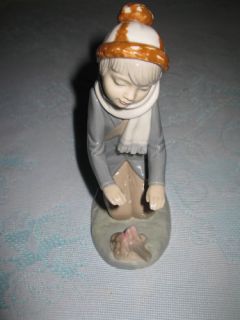 Zaphir Porcelain Figurine Boy Warming Hands Over Fire