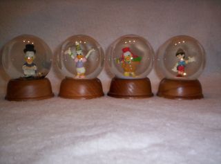 THE FIRST LIMITED EDITION DISNEY CRYSTAL SNOW GLOBE COLLECTION WITH