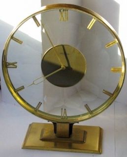 Angelus 8 days clock in brass & scaloped crystal 8 1/2 in.