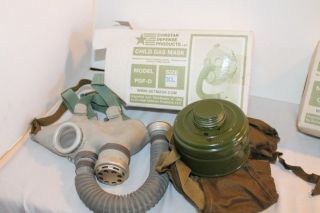 LOT OF TWO GAS MASKS, CIVIL DEFENSE, CHILD AND ADULT GP 5 AND PDF D
