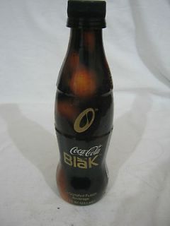 coca cola blak   a 237mm plastic wrapped glass bottle,usa, 2005
