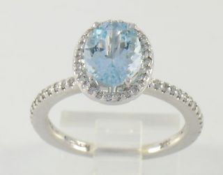 Solid White Gold Aquamarine Ladies Ring with Halo of White Diamonds