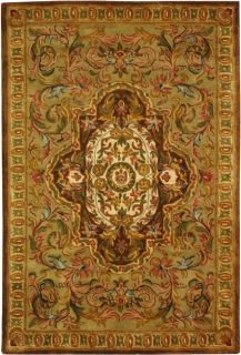 Handmade Classic Royal Beige/ Olive Wool Rug (4 X 6) (BeigePattern OrientalMeasures 0.625 inch thickTip We recommend the use of a non skid pad to keep the rug in place on smooth surfaces.All rug sizes are approximate. Due to the difference of monitor co