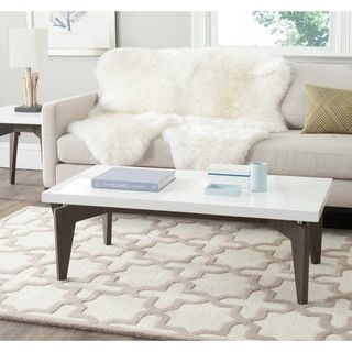 Safavieh Josef White/ Dark Brown Lacquer Coffee Table (White/ Dark BrownMaterials Stainless steel and MDFFinish White and Dark BrownDimensions 15 inches high x 43.3 inches wide x 23.6 inches deepThis product will ship to you in 1 box.Assembly required 