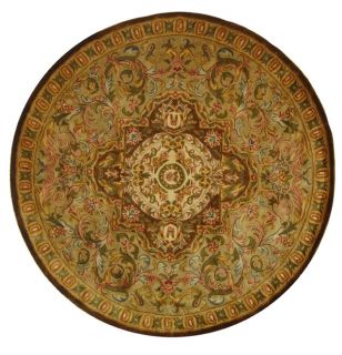 Handmade Classic Royal Beige/ Olive Wool Rug (6 Round) (BeigePattern OrientalMeasures 0.625 inch thickTip We recommend the use of a non skid pad to keep the rug in place on smooth surfaces.All rug sizes are approximate. Due to the difference of monitor 